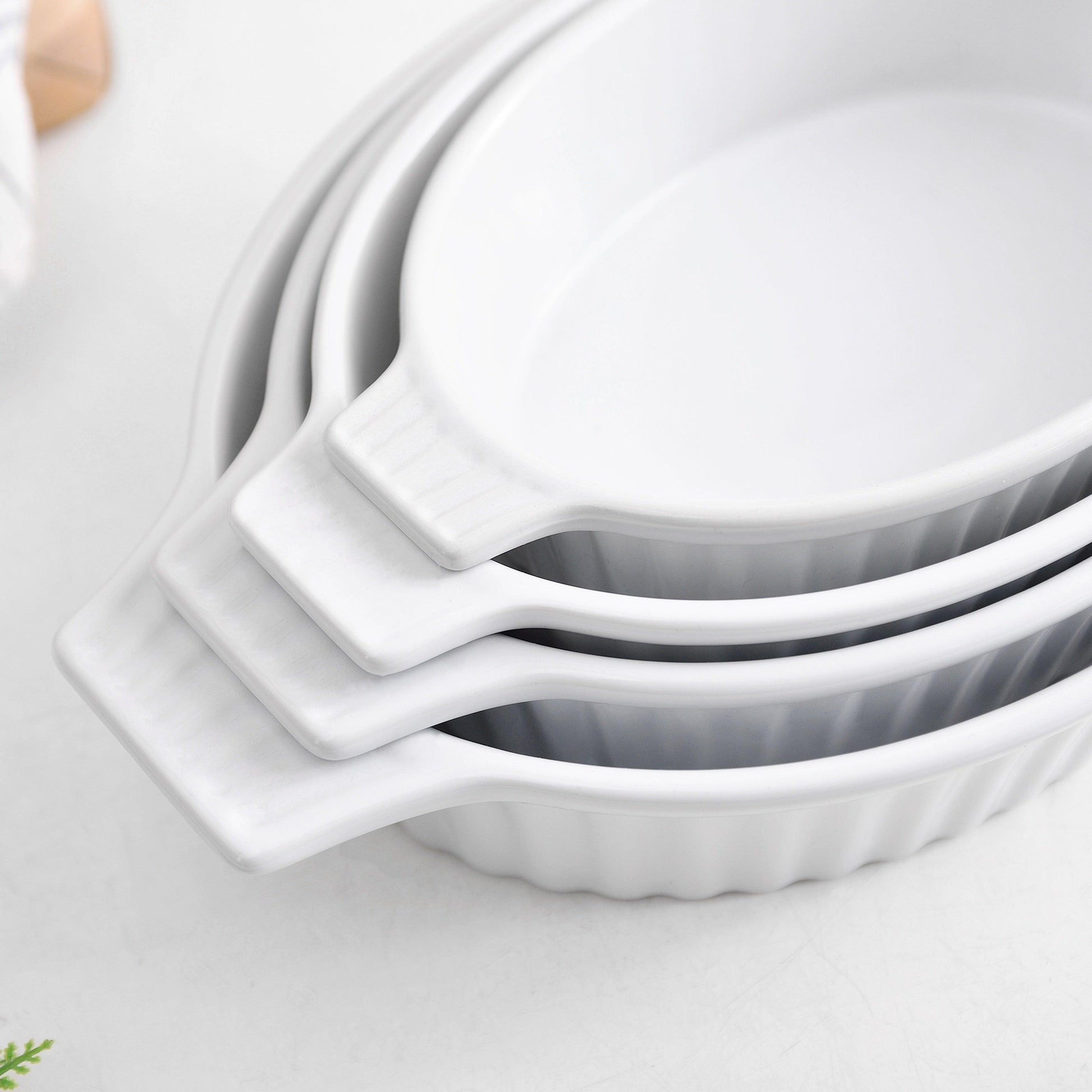 Set of 4 Oval Porcelain Baking Dishes with White Handles - HomeGoods Lima